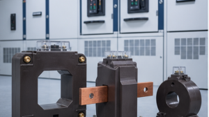 Window, bar-primary and ring current transformers beside electrical switchgear