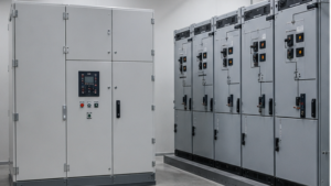 Compact gas-insulated switchgear beside larger air-insulated switchgear in a substation room