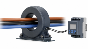 Core balance current transformer surrounding three phase conductors and connected to a protection relay